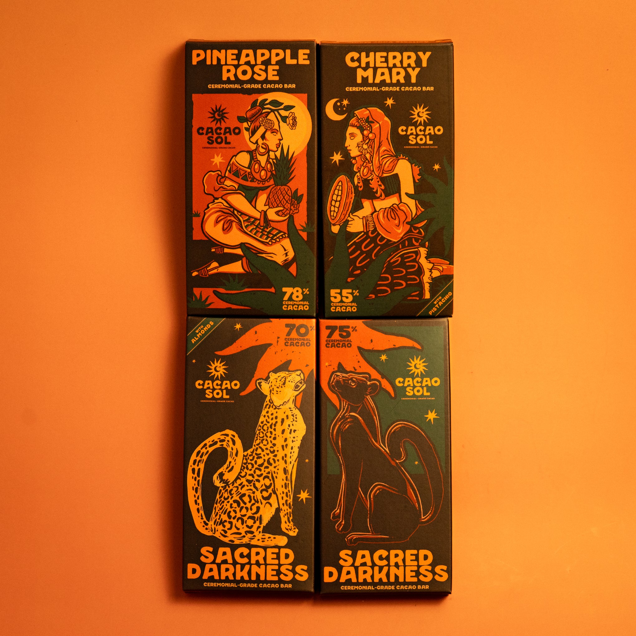 Four  Cacao Sol chocolate bars with illustrations and text on an orange background